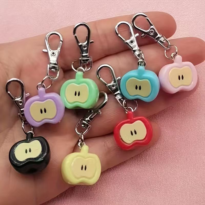 Phone Accessories Keychain - 7-teiliges Set aus Kunstharz-Schlüsselanhängern in Apfelform,